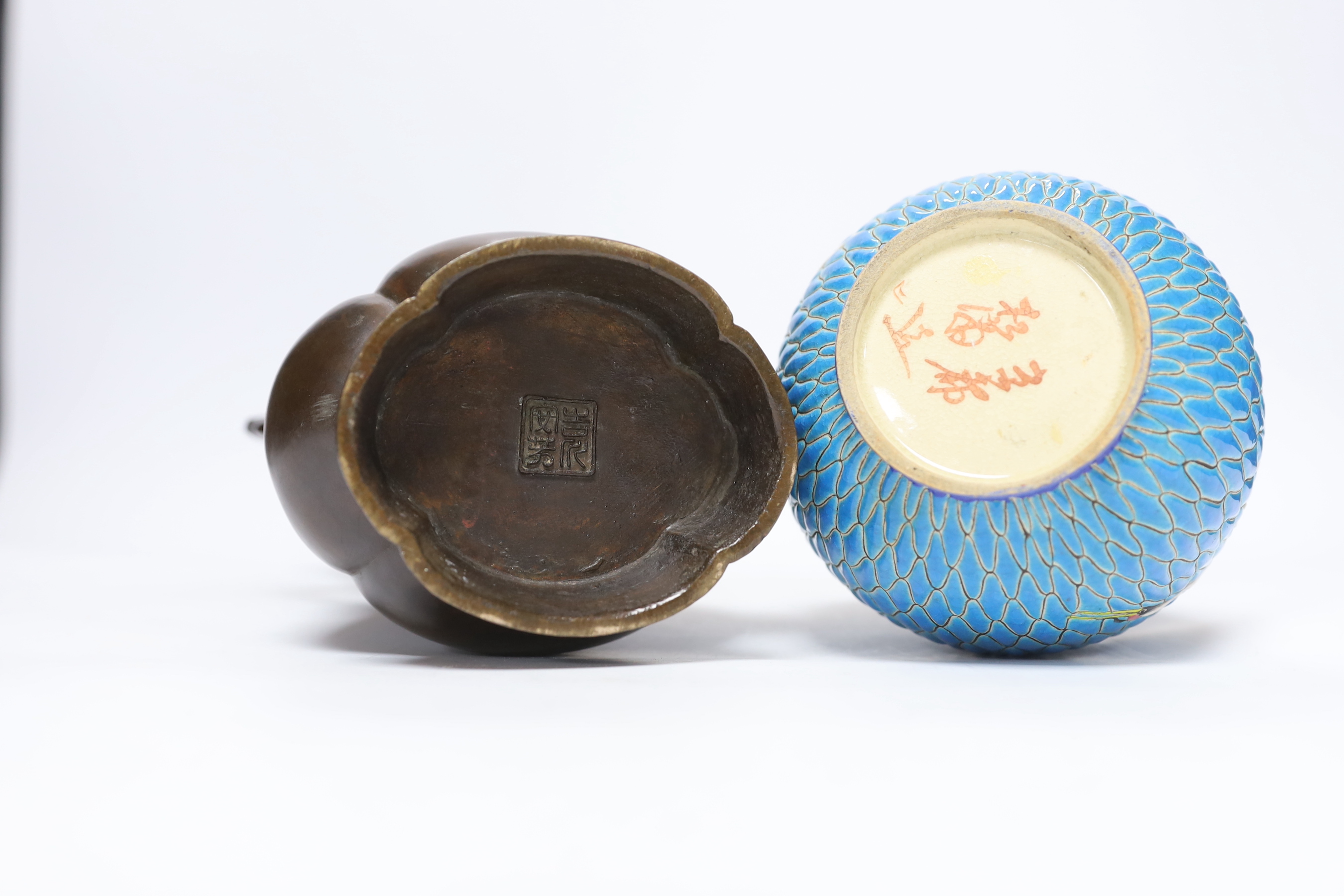 A 19th century Japanese bronze flower vase, with a Japanese enamelled pottery bottle, Meiji, tallest 27 cm (2)